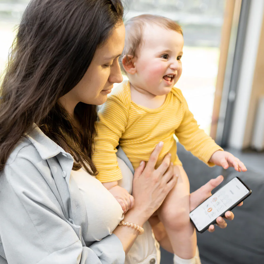 Madre con su bebé usando MediPlanner